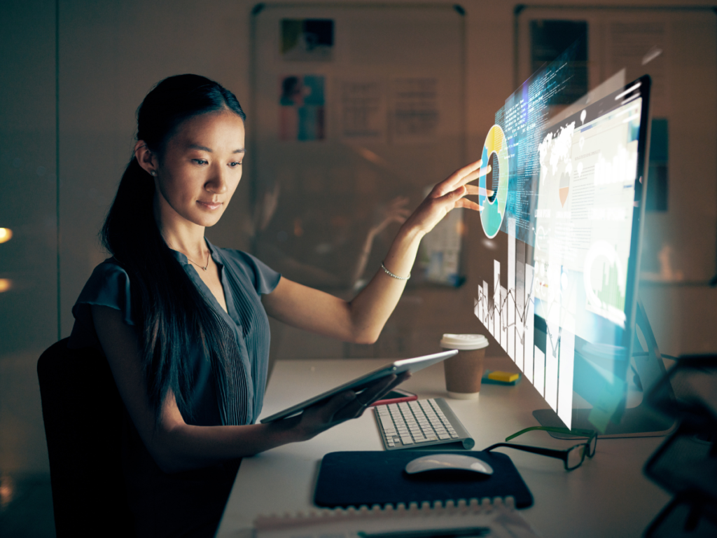 Businesswoman using advanced data analytics technology to manage Canadian capital investments with Capex360.