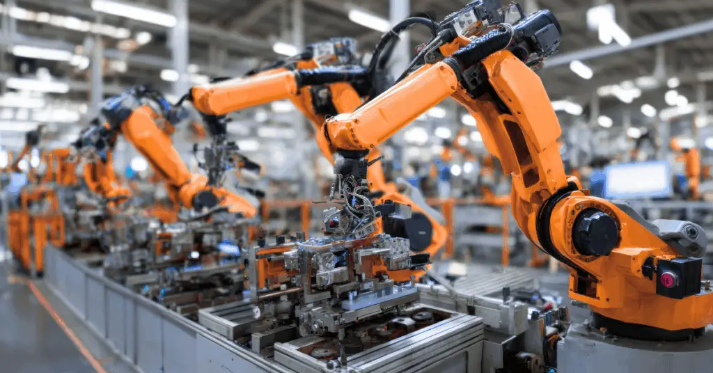 AI-powered factory floor with robotic arms replacing manual labor, illustrating CapEx automation strategy in manufacturing.